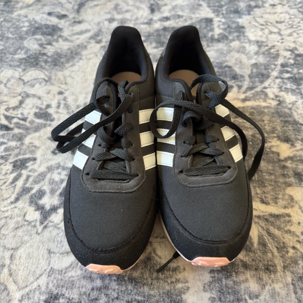 Cute, pink soles, black adidas sneakers. Only worn once.